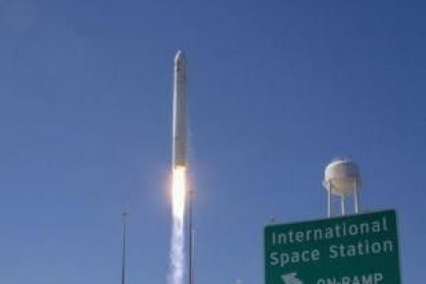 The Orbital Sciences Corporation Antares rocket with the Cygnus cargo spacecraft aboard launches from NASA&#039;s Wallops Flight Facility in Virginia, September 18, 2013. The spacecraft will deliver about 1,300 lbs of cargo, including food and clothing, t