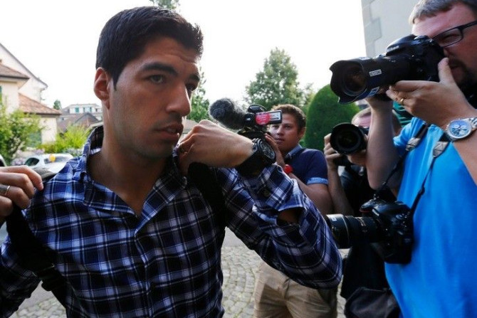 Uruguayan striker Luis Suarez arrives for a hearing at the Court of Arbitration for Sport (CAS) in Lausanne August 8, 2014. Suarez is appealing against a four-month ban from all football-related activities for biting Italy defender Giorgio Chiellini durin