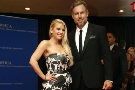 Actors Jessica Simpson and Eric Johnson arrive on the red carpet at the annual White House Correspondents' Association Dinner in Washington, May 3, 2014.