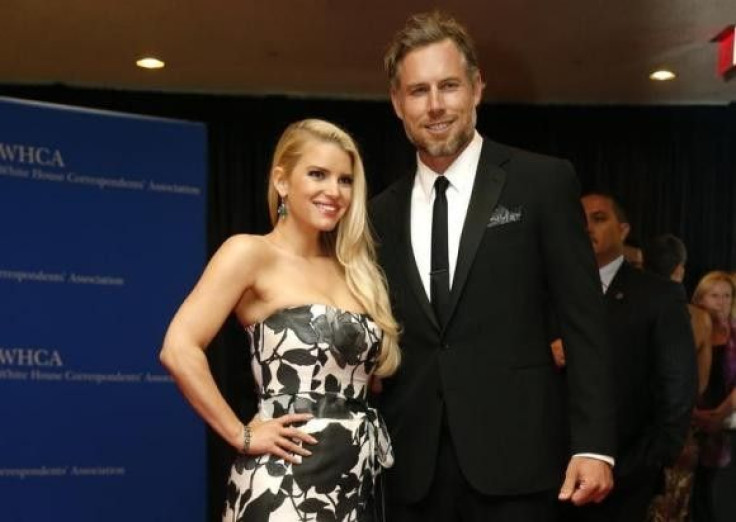 Actors Jessica Simpson and Eric Johnson arrive on the red carpet at the annual White House Correspondents' Association Dinner in Washington, May 3, 2014.