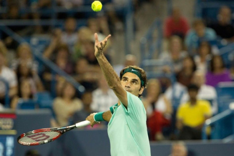 Roger Federer (SUI) serves against Milos Raonic on day six of the Western and Southern Open