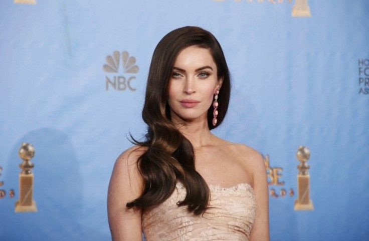 Presenter Megan Fox poses backstage at the 70th annual Golden Globe Awards in Beverly Hills, California, January 13, 2013.