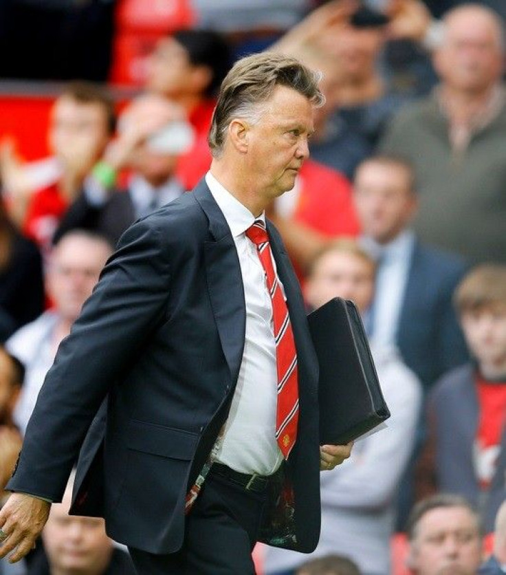 Manchester United&#039;s manager Louis van Gaal leaves the pitch following their English Premier League soccer match defeat against Swansea City at Old Trafford in Manchester, northern England August 16, 2014.