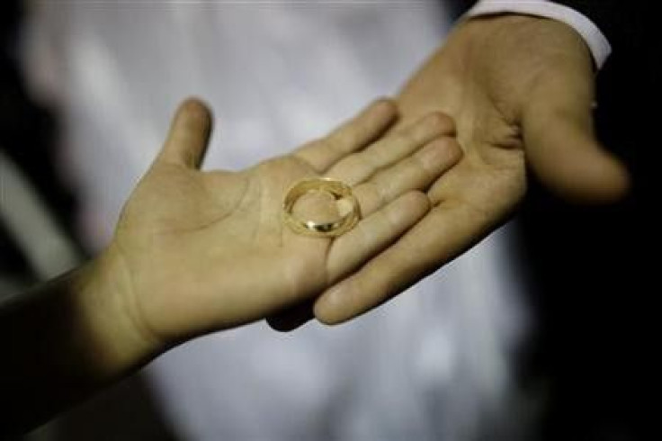 A Wedding Ring Carries by the Couple