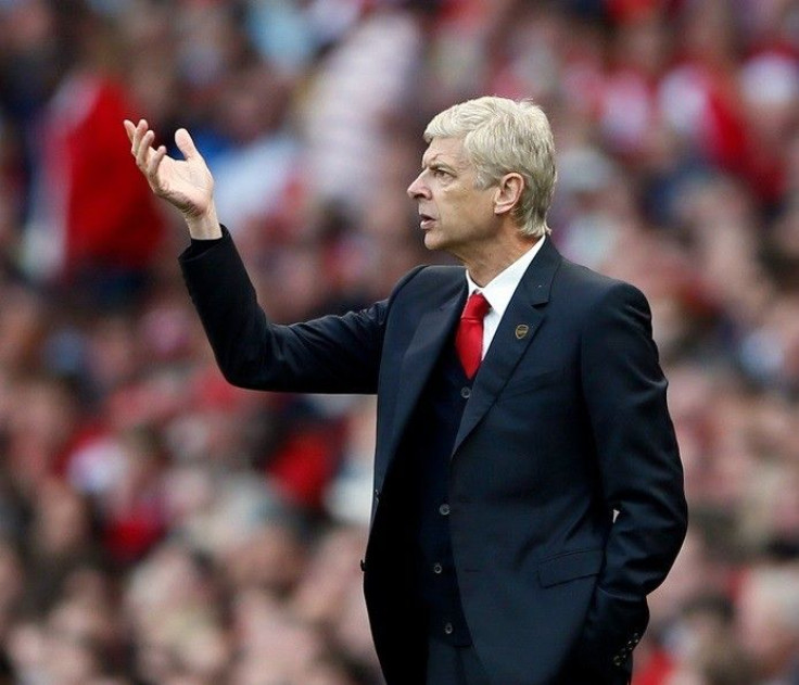 Arsenal's manager Arsene Wenger reacts during their English Premier League soccer match against Crystal Palace at the Emirates stadium in London August 16, 2014.