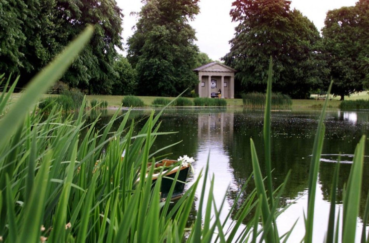 The Temple Commemorating Diana, Princess Of Wales, Is Reflected In The Lake Of Her Family Home At Althorp, Near Northampton.