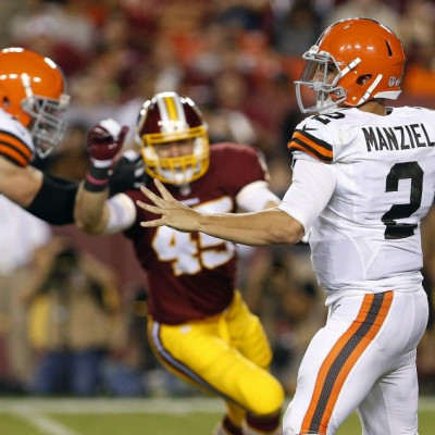 Aug 18, 2014; Landover, MD, USA; Cleveland Browns quarterback Johnny Manziel (2) throws the ball as Washington Redskins linebacker Gabe Miller (45) chases in the third quarter at FedEx Field. The Redskins won 24-23.