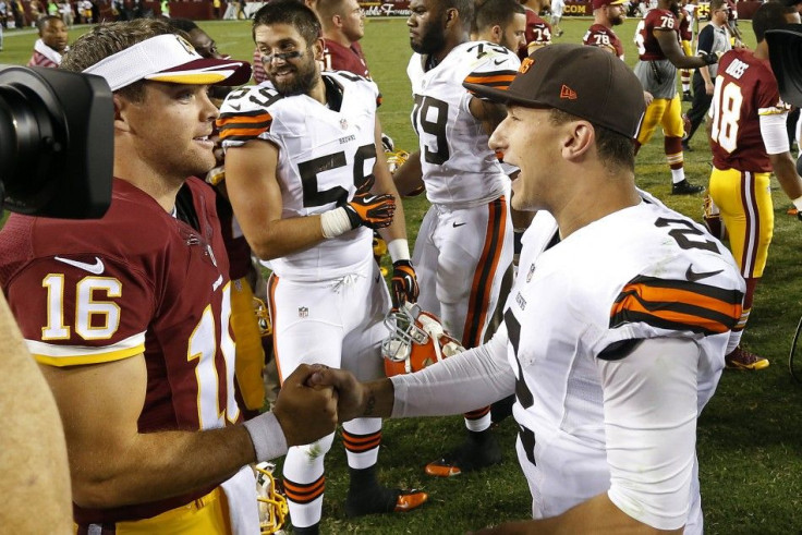 Aug 18, 2014; Landover, MD, USA; Washington Redskins quarterback Colt McCoy (16) shakes hands with Cleveland Browns quarterback Johnny Manziel (2) after their game at FedEx Field. The Redskins won 24-23.