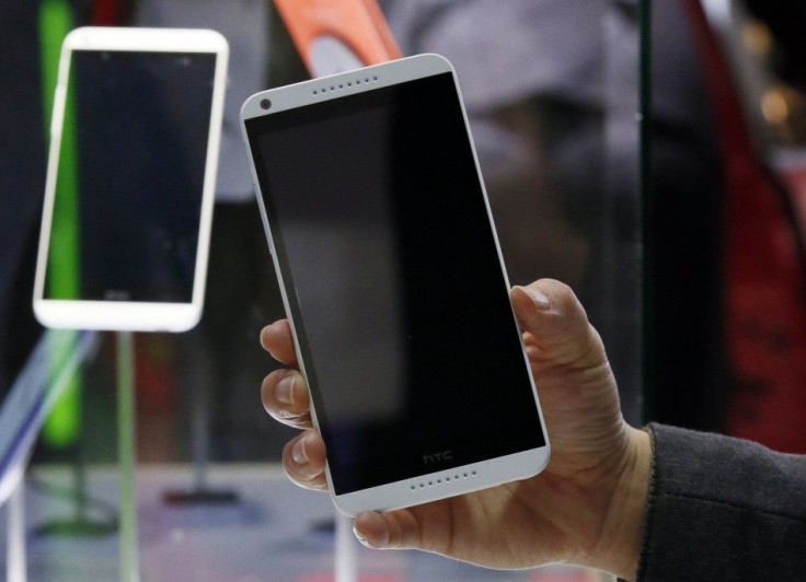A model holds up the HTC Desire 816