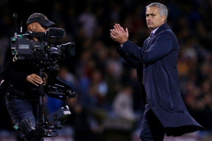 Chelsea&#039;s manager Jose Mourinho applauds after their English Premier League soccer match against Burnley at Turf Moor in Burnley, northern England August 18, 2014.