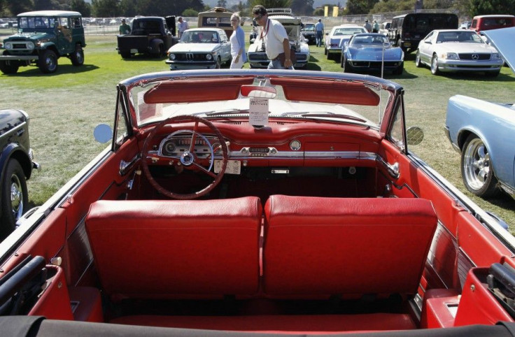 A 1963 Ford Falcon convertible sits in the sold lot during the Mecum car auction in Monterey