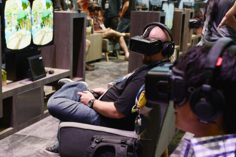 An Attendee Tries On The Oculus VR Inc. Rift Development Kit 2 Headset At The 2014 Electronic Entertainment Expo (E3) In Los Angeles, California