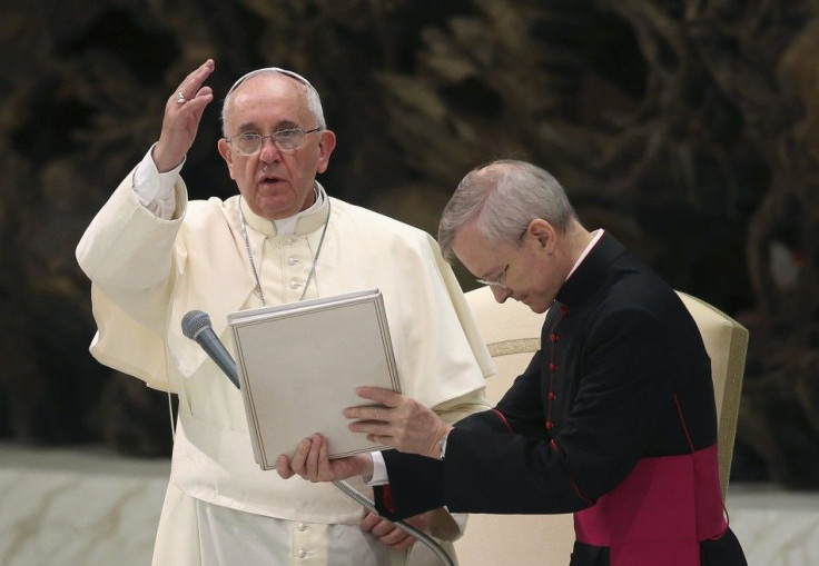 Pope Francis blesses during his Wednesday general audience in the Paul VI hall at the Vatican