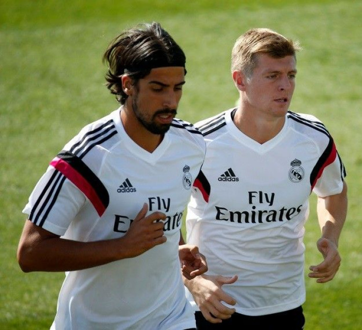 Real Madrid's Sami Khedira (L) and Toni Kroos attend a training session at Valdebebas training grounds, outside Madrid August 5, 2014.