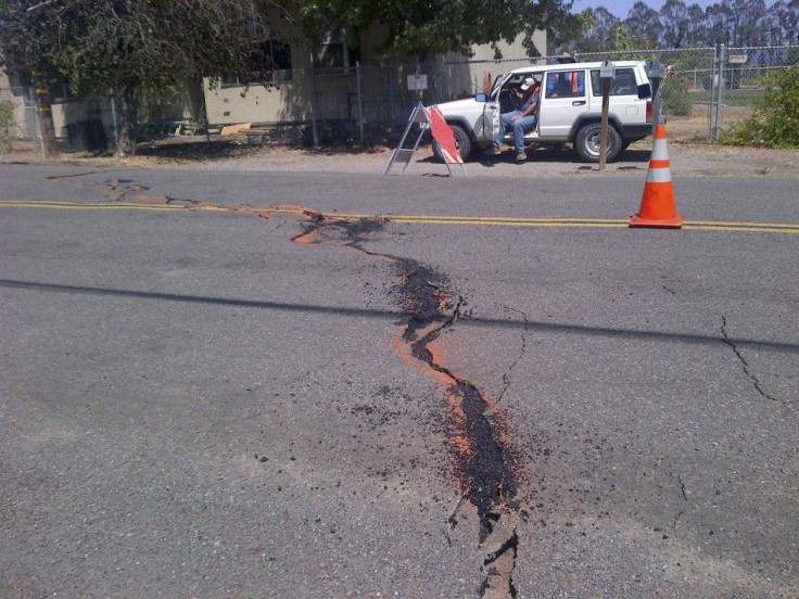 A crack runs across the road following an earthquake in Saintsbury, California