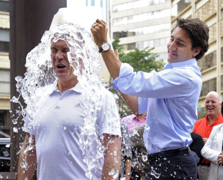 Liberal leader Justin Trudeau dumps a bucket of ice water onto Liberal MP Sean Casey for the ALS ice bucket challenge in Edmonton