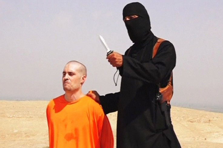 Still image from undated video of a masked Islamic State militant holding a knife speaking next to man purported to be James Foley at an unknown location