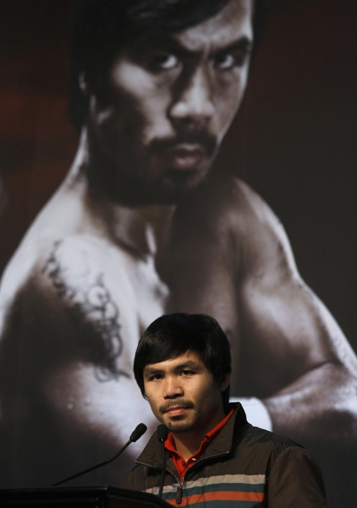 Manny Pacquiao from the Philippines attends a news conference at Venetian Macao in Macau August 25, 2014.