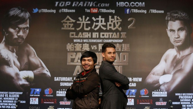 Manny Pacquiao (L) from the Philippines and Chris Algieri of the U.S. pose during a news conference at Venetian Macao