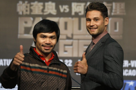 Manny Pacquiao (L) from the Philippines and Chris Algieri of the U.S. give thumbs up during a news conference at Venetian Macao
