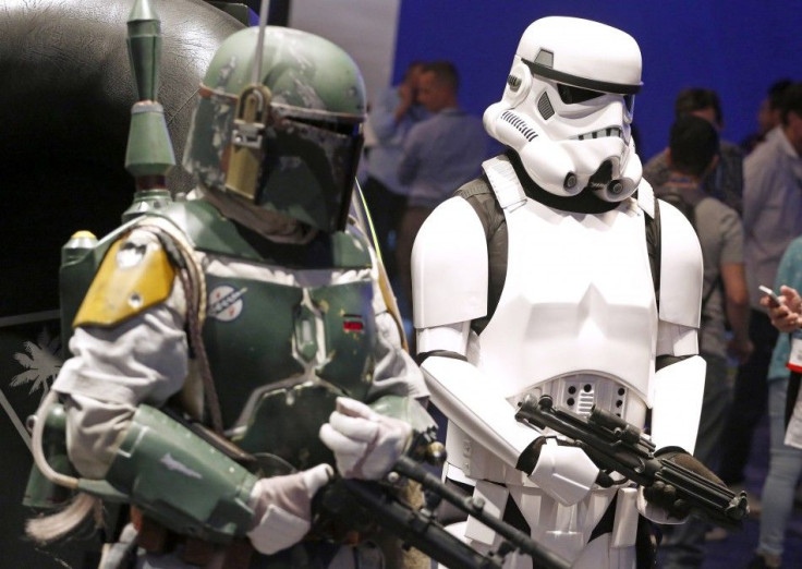 People Dressed As &#039;Star Wars&#039; Characters Boba Fett, Left, And A Stormtrooper.