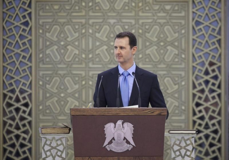 Syria's President Bashar al-Assad delivers a speech at al-Shaab presidential palace in Damascus