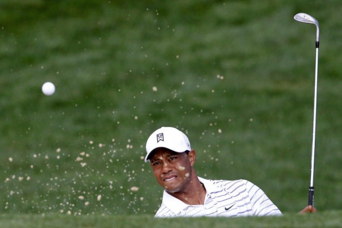 Tiger Woods of the U.S. hits from a sand trap on the 12th hole during the second round of the PGA Championship at Valhalla Golf Club in Louisville