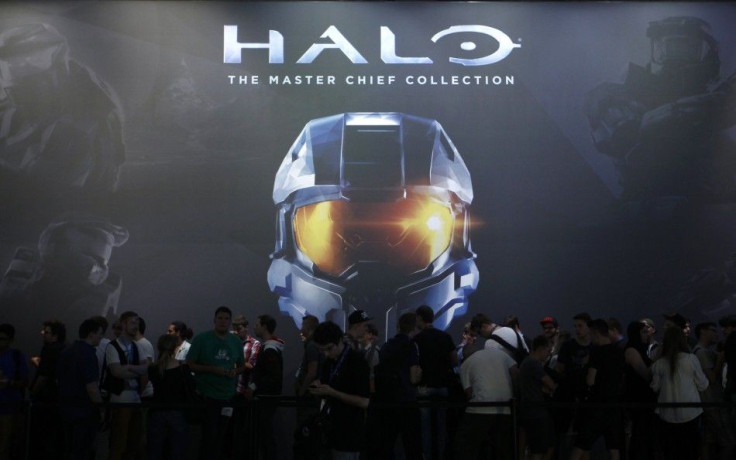 Vistors wait at the &quot;Halo: The Master Chief Collection&quot; exhibition stand during the Gamescom 2014 fair in Cologne August 13, 2014. 