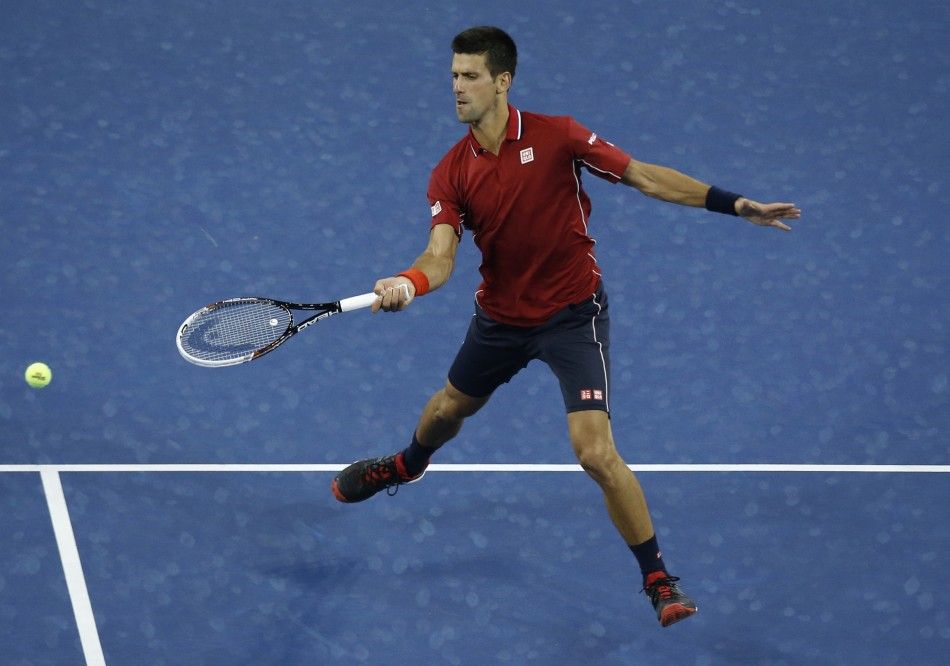 Novak Djokovic of Serbia returns a shot to Diego Schwartzman of Argentina
