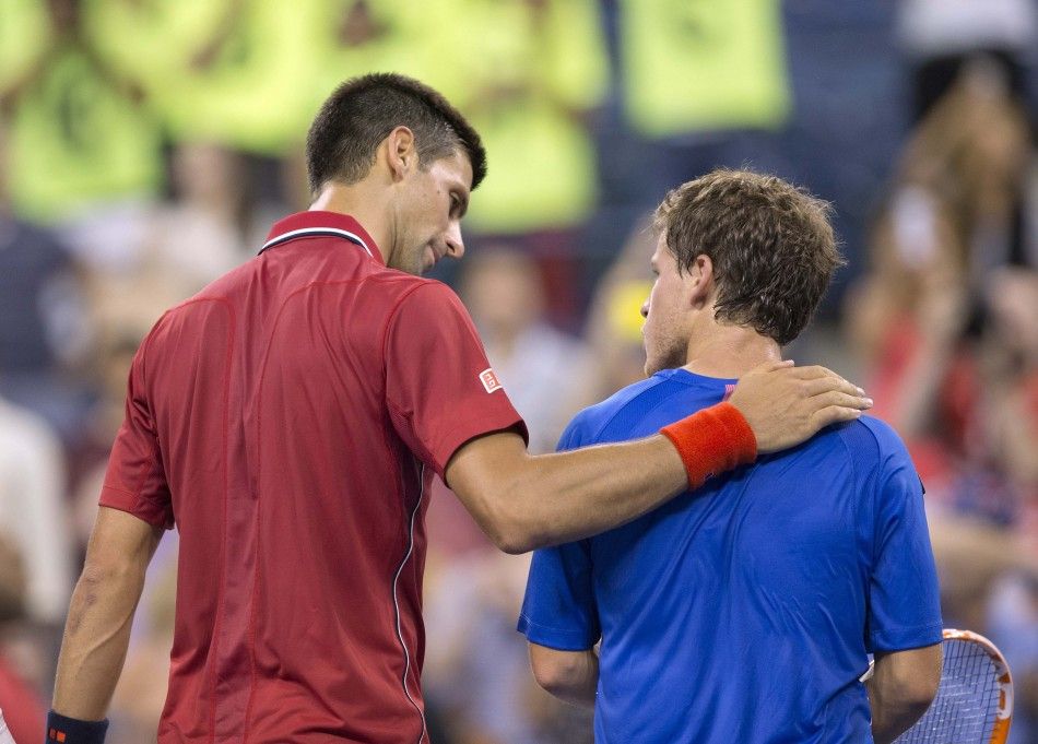 Novak Djokovic SRB at the net with Diego Schwartzman ARG 