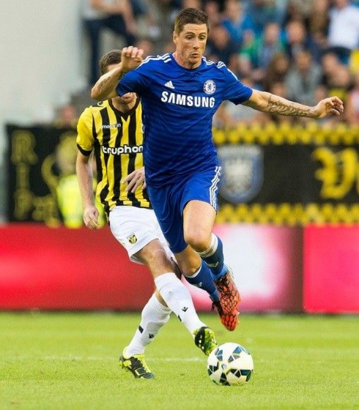 Chelsea&#039;s Fernando Torres fights for the ball with Arnold Kruiswijk of Vitesse Arnhem during their friendly soccer match in Arnhem July 30, 2014.