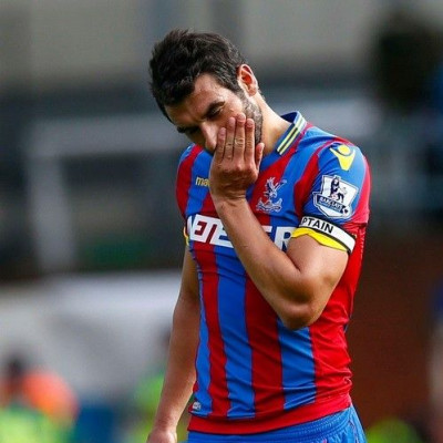Crystal Palace&#039;s Mile Jedinak reacts as he leaves the pitch following their defeat to West Ham United in their English Premier League soccer match at Selhurst Park in London, August 23, 2014.