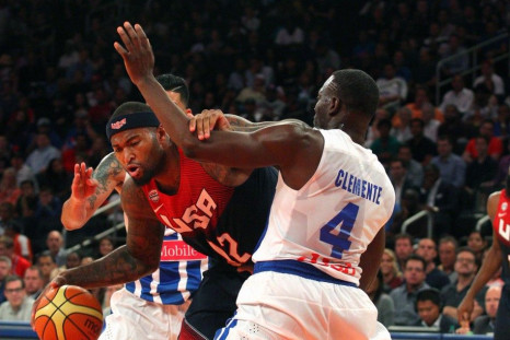 United States center DeMarcus Cousins controls the ball against Puerto Rico center Ramon Clemente