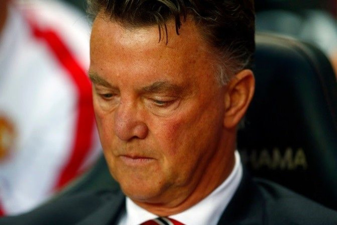 Manchester United manager Louis van Gaal reacts during their League Cup soccer match against Milton Keynes Dons at stadiummk in Milton Keynes, north of London August 26, 2014.