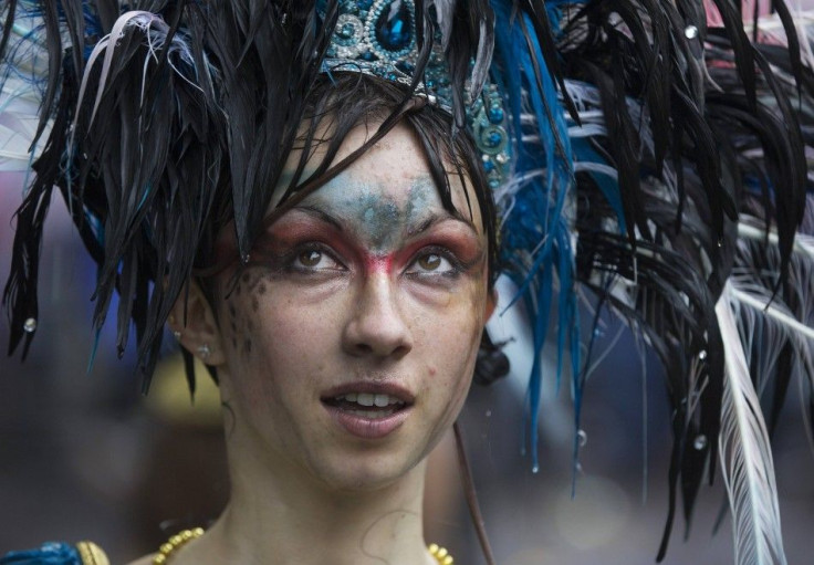A performer takes part in the Notting Hill Carnival in west London