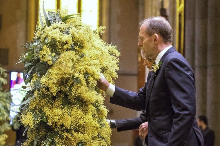 Australian PM Abbott and his wife attend a national memorial service for the victims of Malaysia Airlines flight MH17 at St Patrick&#039;s Cathedral in Melbourne