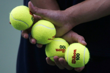 A ball boy holds balls during a match during at the 2014 U.S. Open