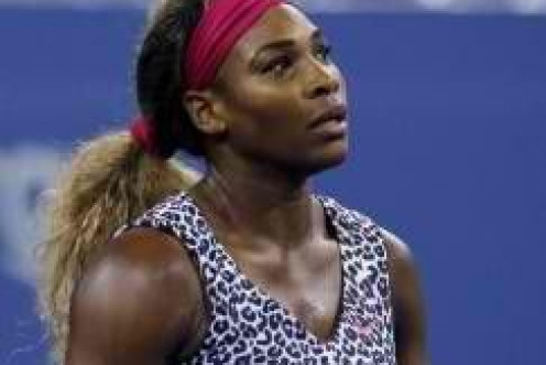 Serena Williams of the U.S.celebrates defeating compatriot Taylor Townsend during their women's singles match at the U.S. Open tennis tournament in New York August 26, 2014. REUTERS/Shannon Stapleton 