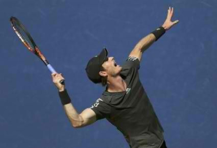 Andy Murray of Britain serves to Robin Haase of the Netherlands during their match at the 2014 U.S. Open tennis tournament in New York, August 25, 2014. REUTERS/Adam Hunger