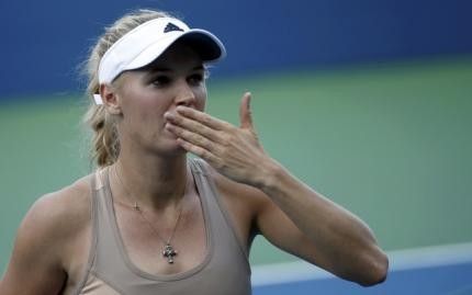 Caroline Wozniacki of Denmark blows a kiss after defeating Aliaksandra Sasnovich of Belarus during their match at the 2014 U.S. Open tennis tournament in New York, August 27, 2014. REUTERSMike Segar
