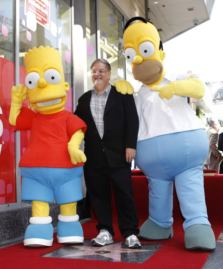 Matt Groening, creator of &quot;The Simpsons,&quot; stands on his star with characters Homer (R) and Bart Simpson