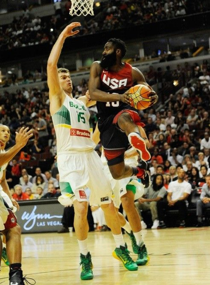United States guard James Harden (13) is defended by Brazil center Tiago Splitter (15) during the second half at the United Center. The United States defeated Brazil 95-78.