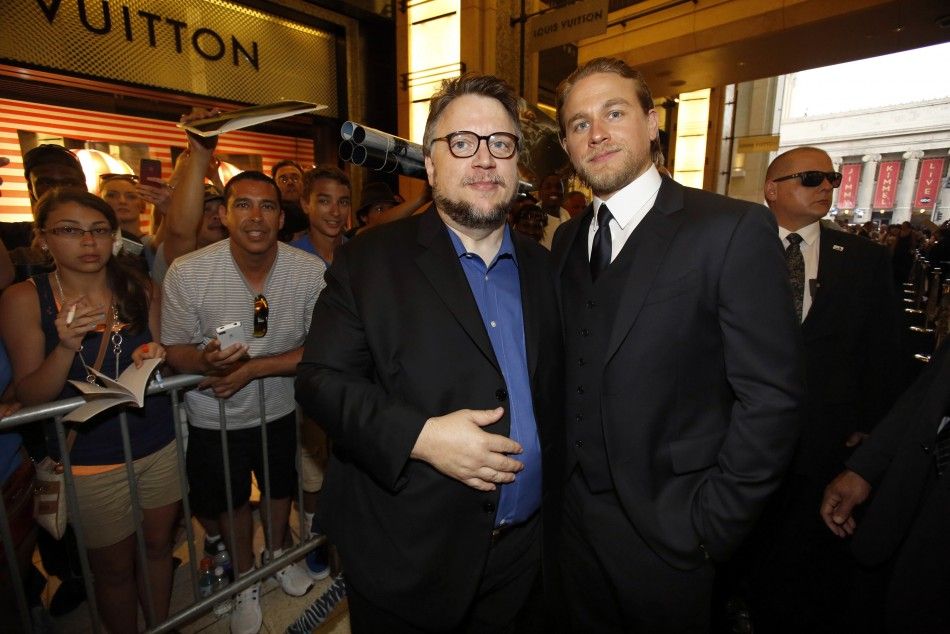 Director Guillermo del Toro L Poses With Cast Member Charlie Hunnam At The Premiere Of Pacific Rim At Dolby Theatre In Hollywood