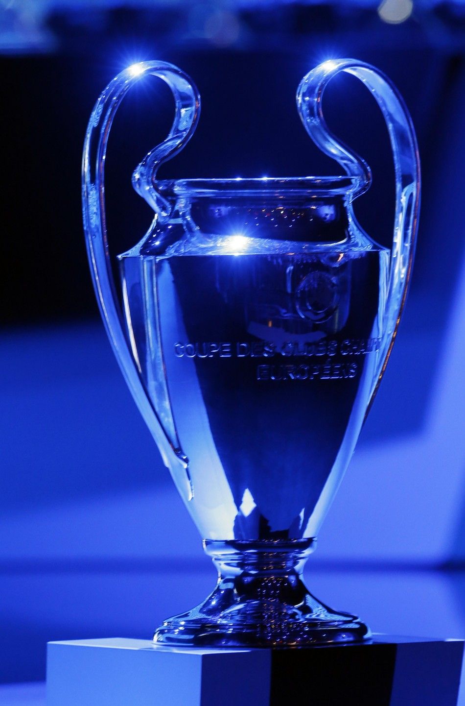 Blue light shines on the Champions league soccer trophy during the draw ceremony for the 20142015 Champions League soccer competition at Monacos Grimaldi Forum in Monte Carlo August 28, 2014. 