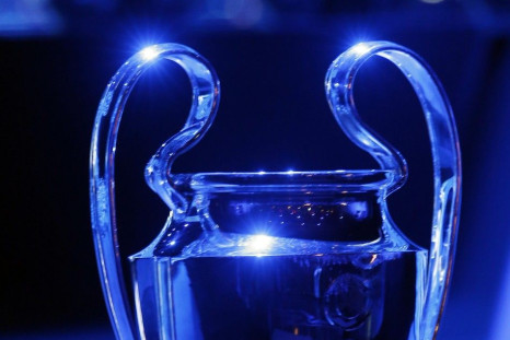 Blue light shines on the Champions league soccer trophy during the draw ceremony for the 2014/2015 Champions League soccer competition at Monaco's Grimaldi Forum in Monte Carlo August 28, 2014. 
