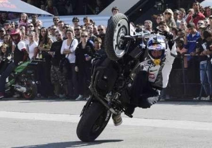 German motorbike stunt rider Chris Pfeiffer performs at the Macedonian capital of Skopje