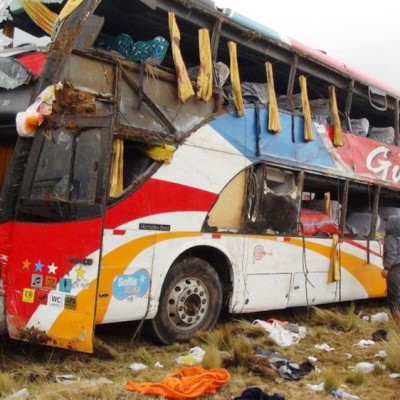 People inspect a bus after an accident at Peru&#039;s Andean province of Junin