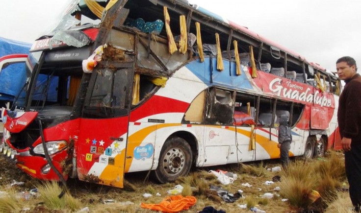 People inspect a bus after an accident at Peru&#039;s Andean province of Junin