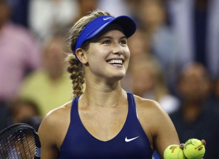 Eugenie Bouchard of Canada smiles as she hits a ball into the crowd after defeating Barbora Zahlavova Strycova of the Czech Republic after their women's singles match at the 2014 U.S. Open tennis tournament in New York August 30, 2014. REUTERS/Adam Hunger
