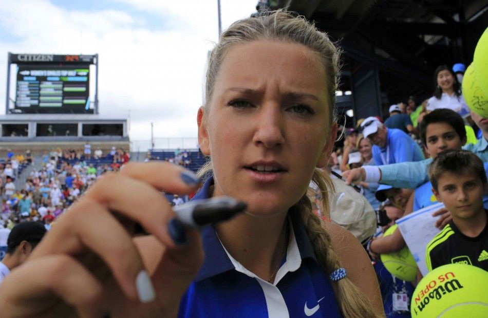 Victoria Azarenka of Belarus signs autographs after defeating Elena Vesnina of Russia at the 2014 U.S. Open tennis tournament in New York, August 30, 2014. REUTERSEduardo Munoz 